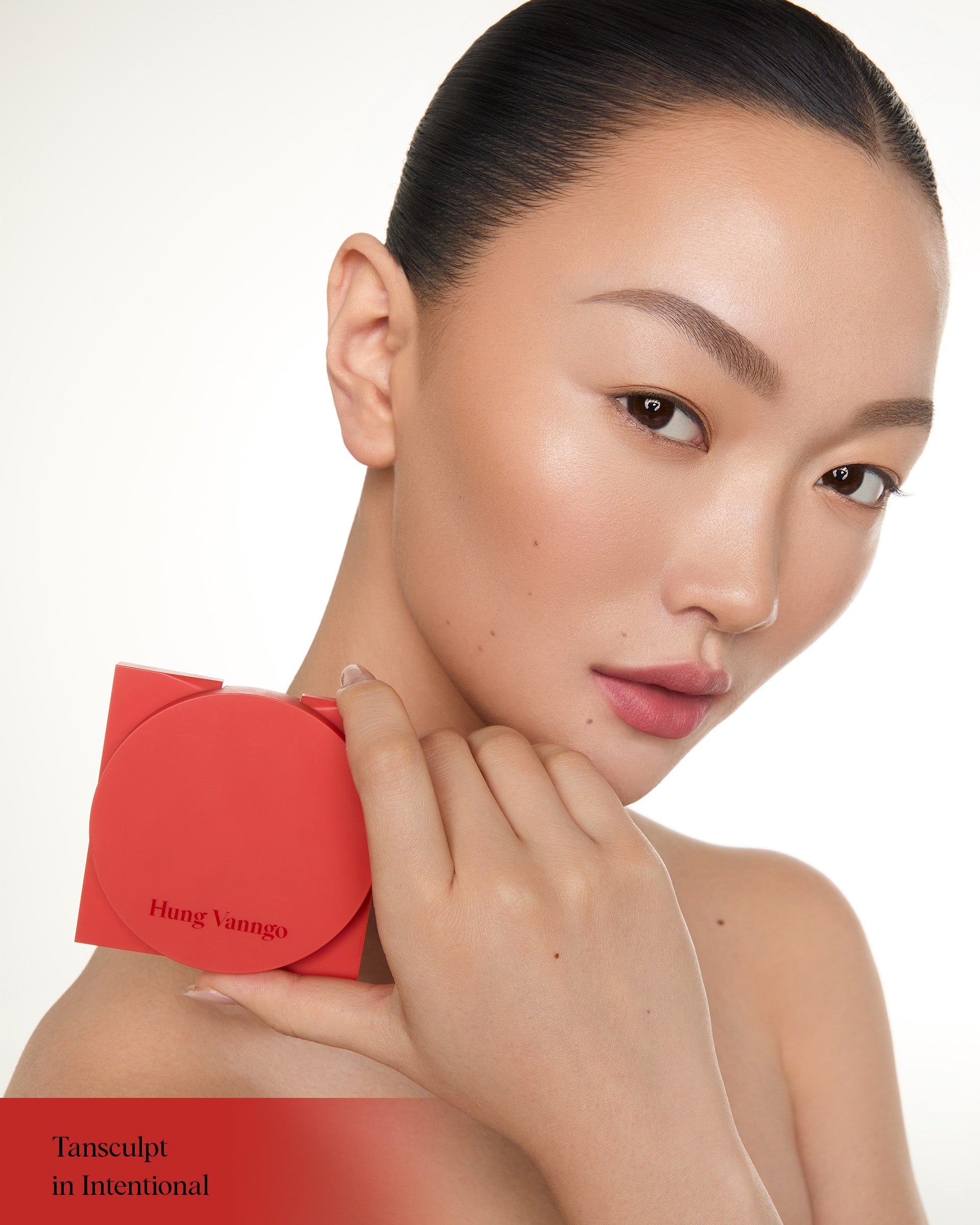 Close-up of a model wearing Hung Vanngo Tansculpt cream contour in Intentional
